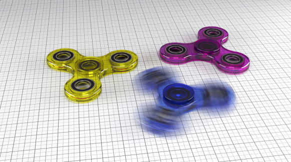 Figure shows three fidget spinners with one in motion.
