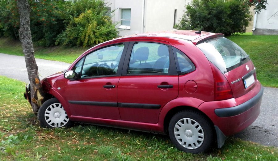 The chemical energy stored in the fuel that has been burned is exactly equal to the energy rejected by the exhaust pipe, plus the energy dissipated by friction, plus the kinetic energy of the moving car. All this energy is transformed into heat, *but never destroyed*, once the car is stopped (whichever the means!).