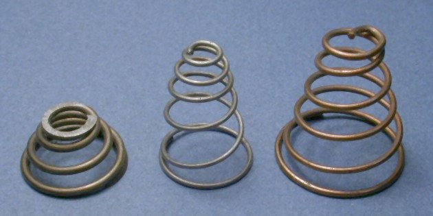 Conical springs, whose stiffness increases exponentially when compressed. We will see in chapter 2 (closed systems) that when fluids are com