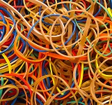 Rubber bands are one type of elastic solid that can be described with continuous formalism. (CC BY-SA 3.0; Bill Ebbesen)